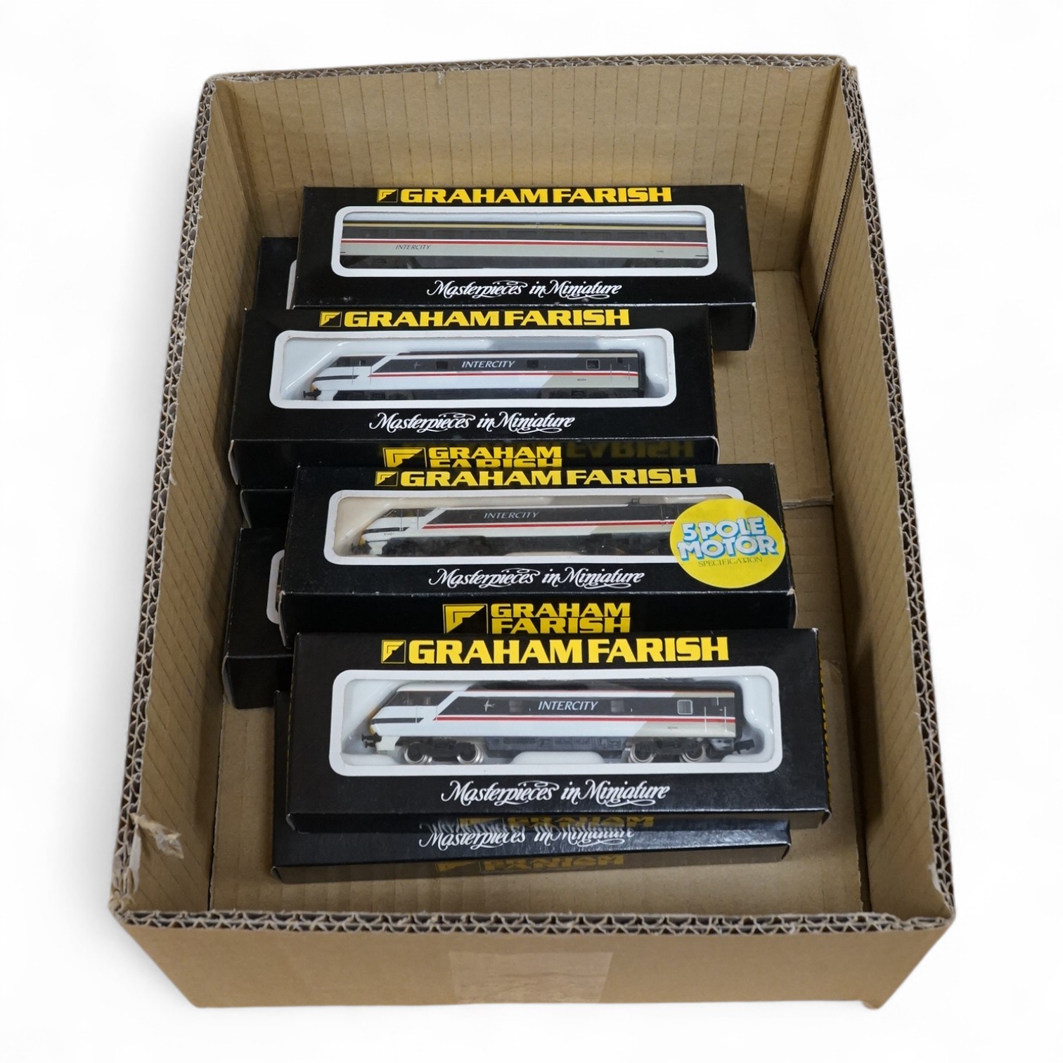 Eight boxed Graham Farish N gauge railway in BR Intercity livery, including a class 91 electric locomotive 91007 (8807), together with two unpowered dummy trailer units (both 0867), and five bogie coaches. Condition - go